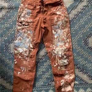 Women’s paint splatter paints in warm brown
